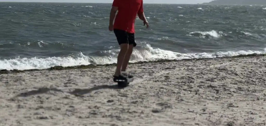 onewheel in sand from the beach